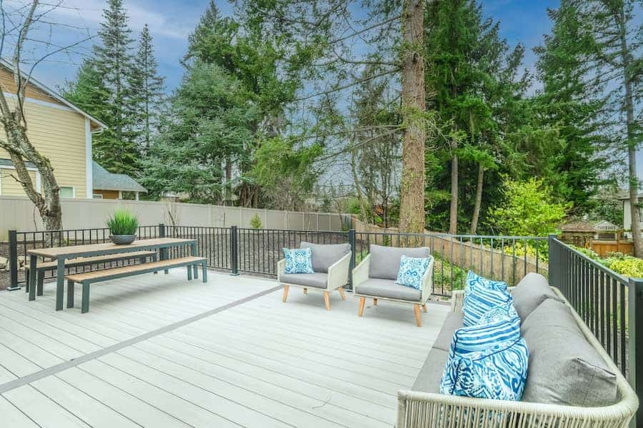 An image of a deck with tables and chairs