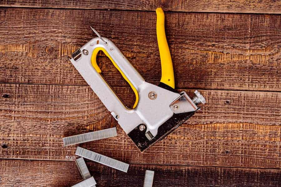 An image of a staple in a wooden table