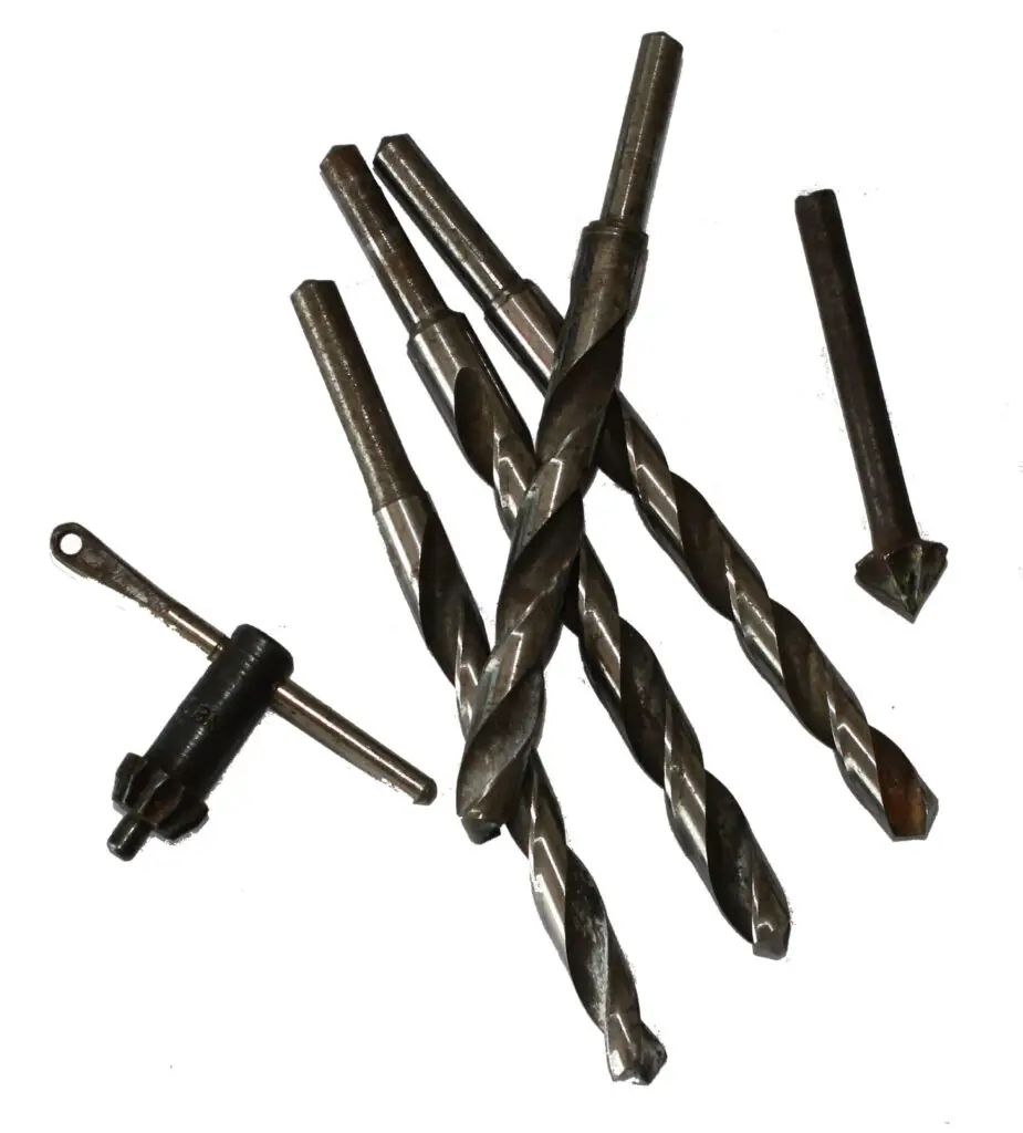 Drill bits of various sizes placed on a white background