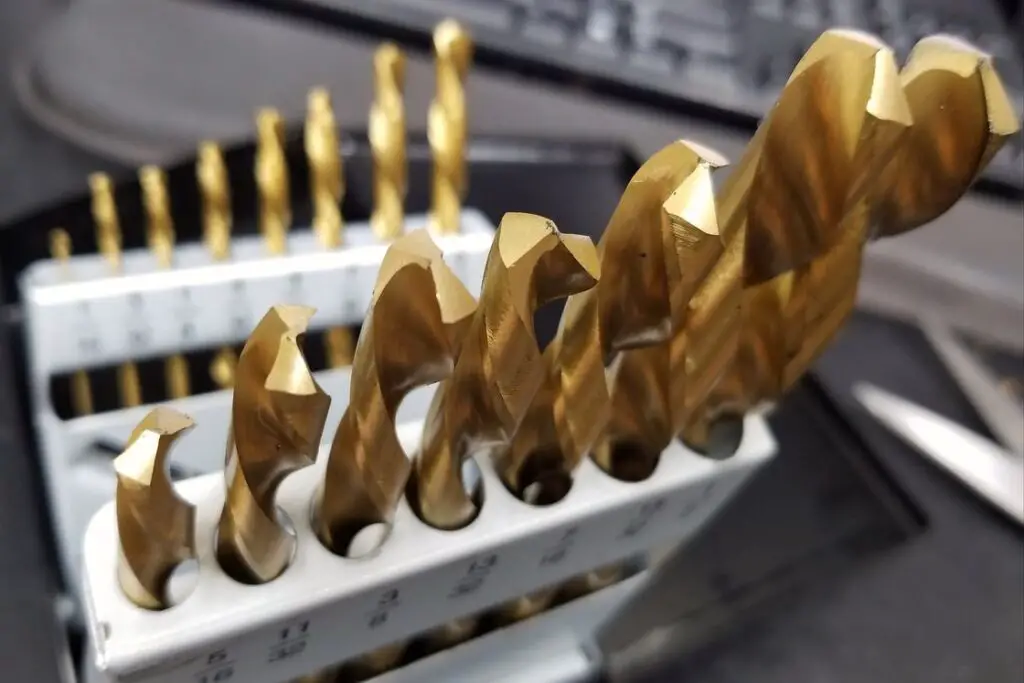Gold drill bits stored upright in their containers