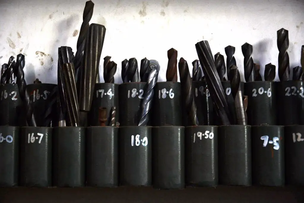 Drill bits stored in labeled containers
