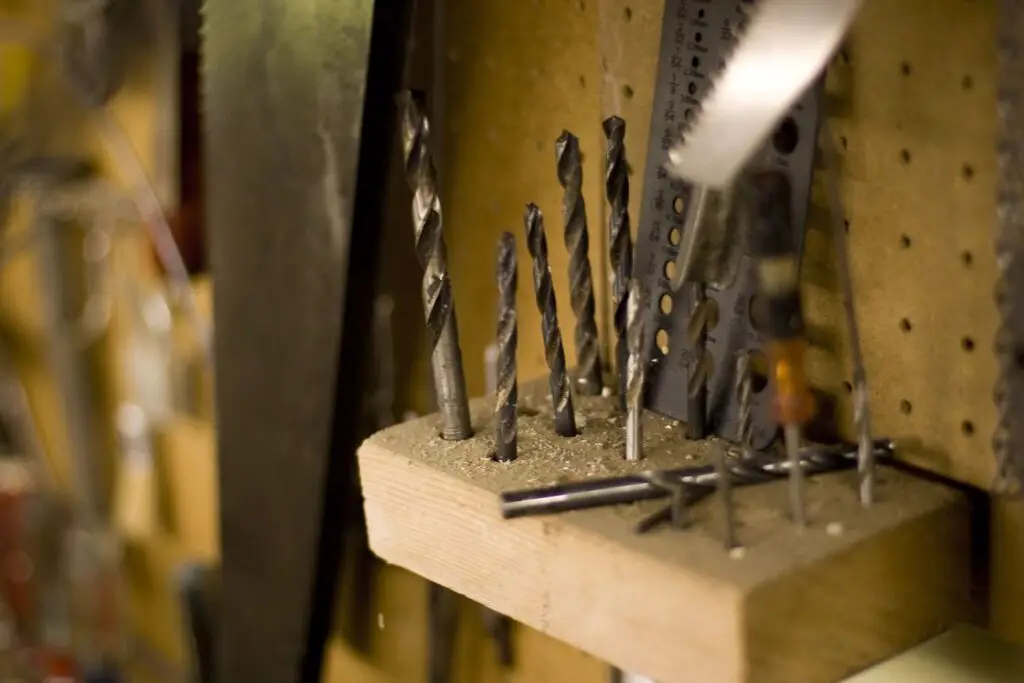 Drill bits held upright by a DIY wooden storage unit