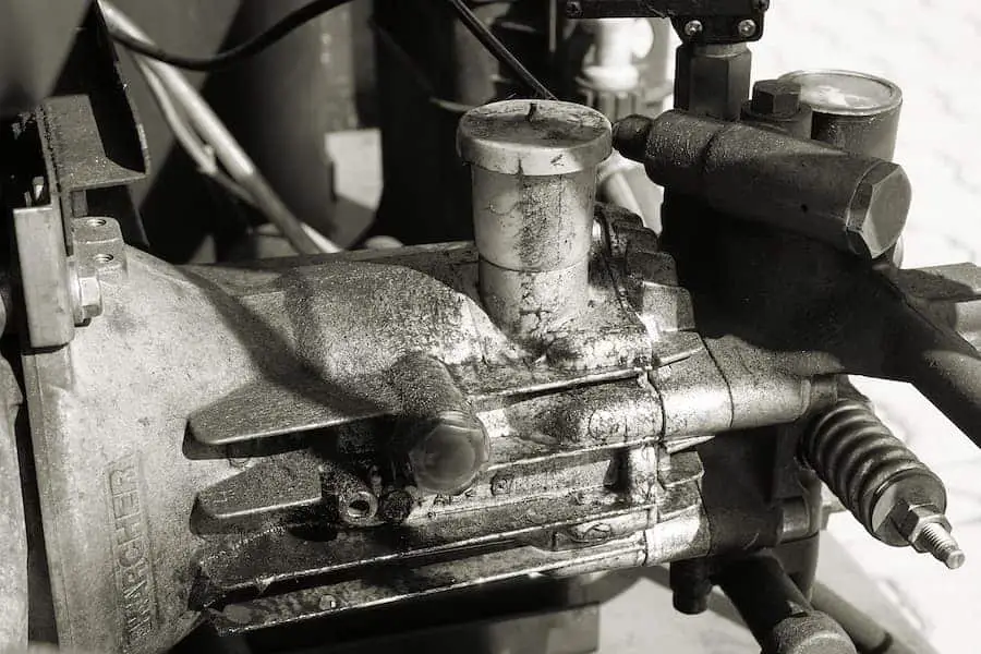 Black and white image of a rusty air compressor