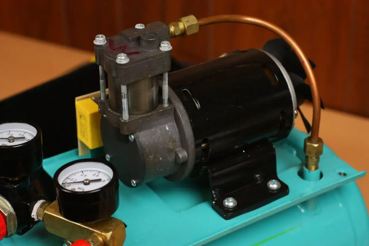 A brand new air compressor showing the pressure gauge and compressor motor