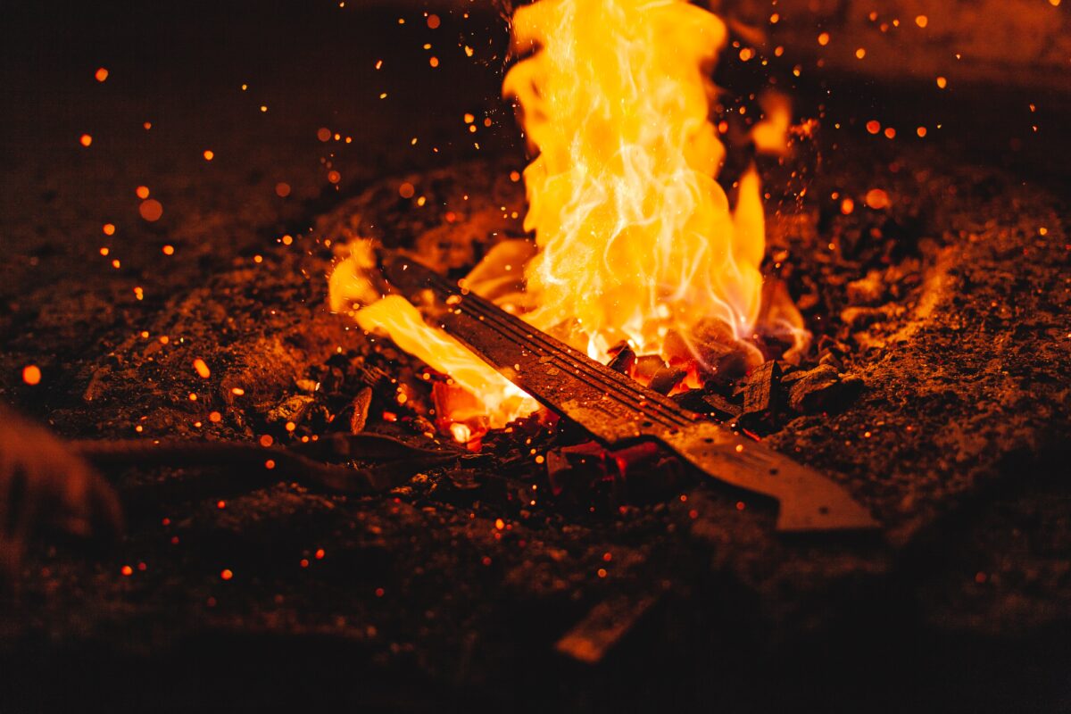 Knife laying on a burning fire