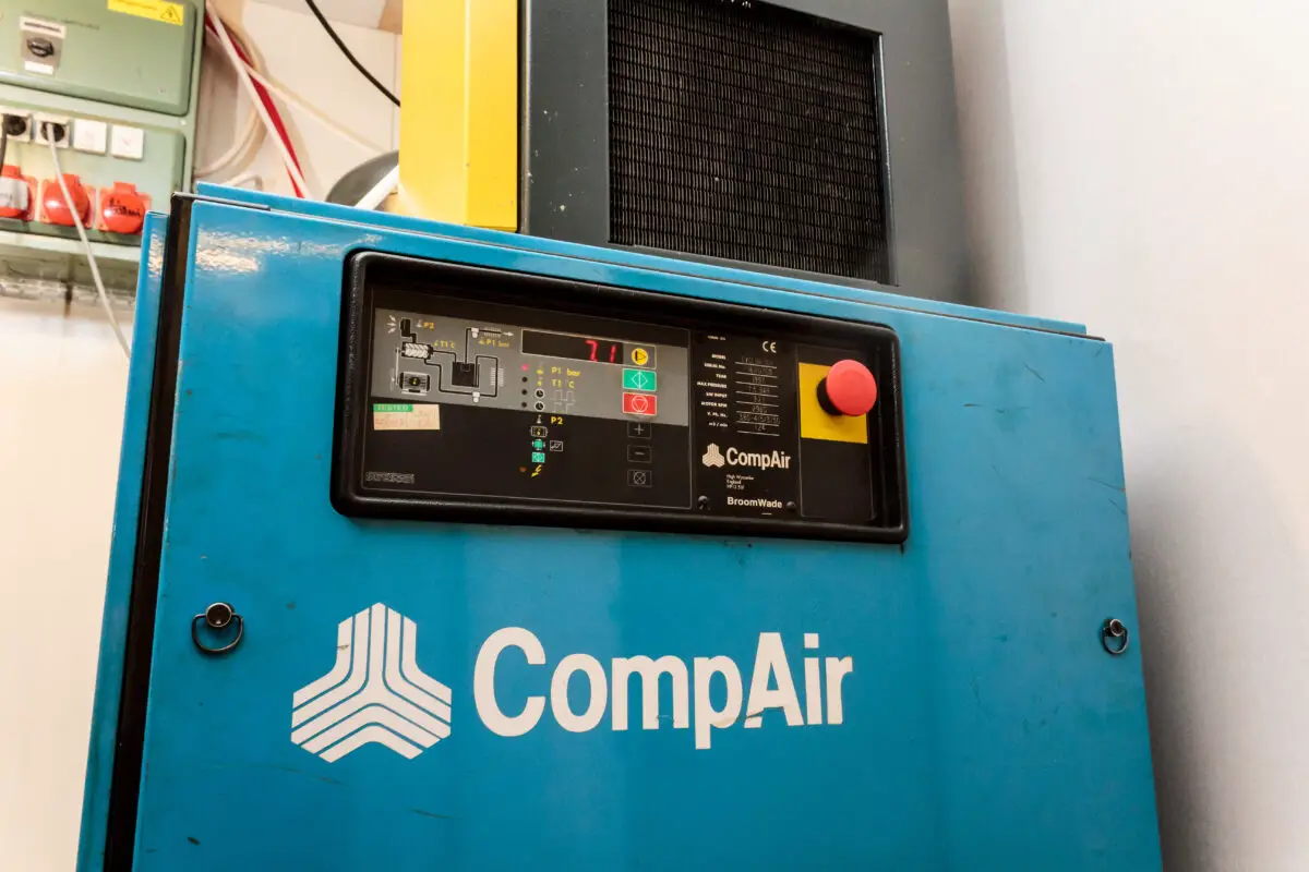 A big blue industrial air compressor